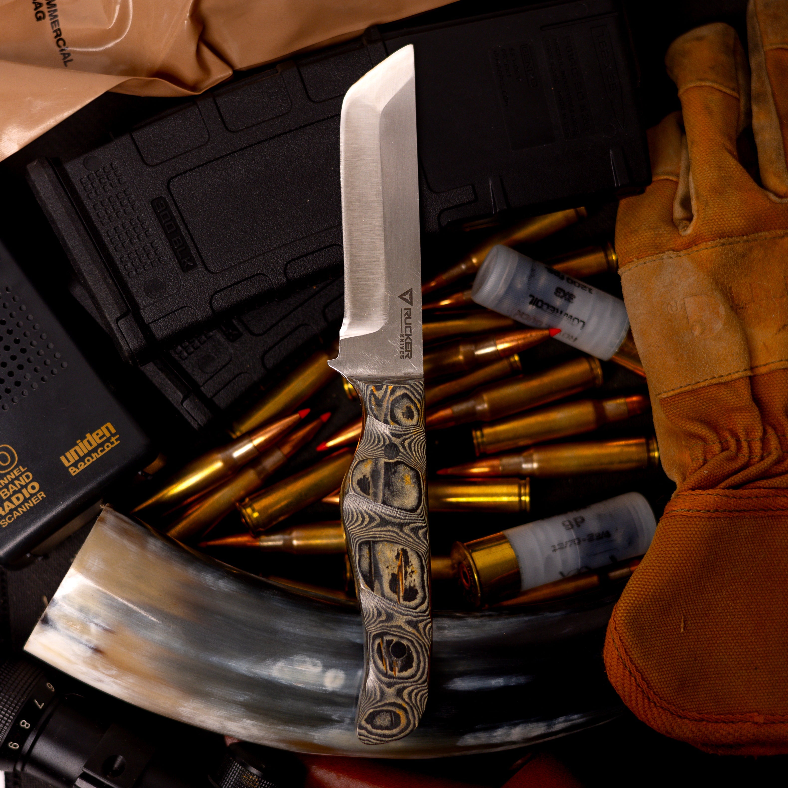 Rucker Knives Tabo Knife staged background on magazine, work glove and MRE