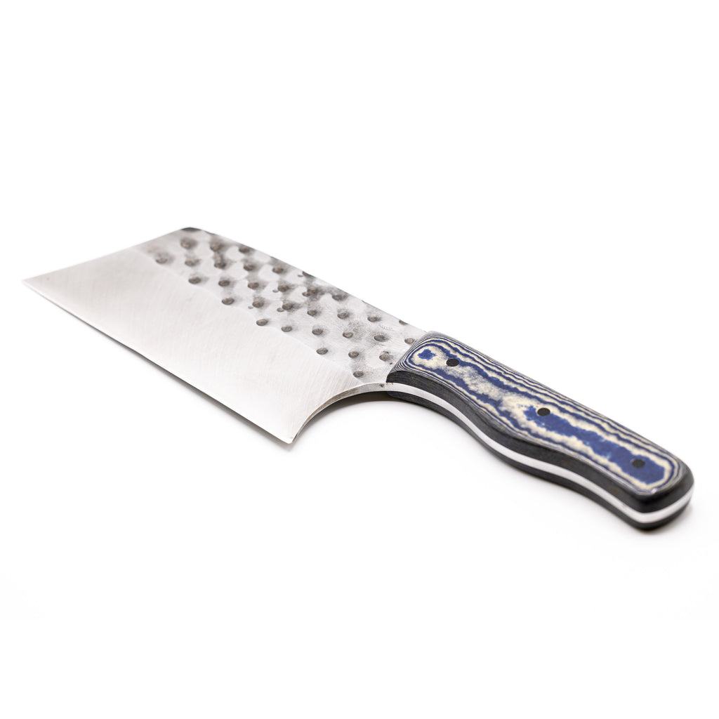 Rucker Knives Sawtooth Cleaver with a blue canyon maple handle, on white background diagonal orientation